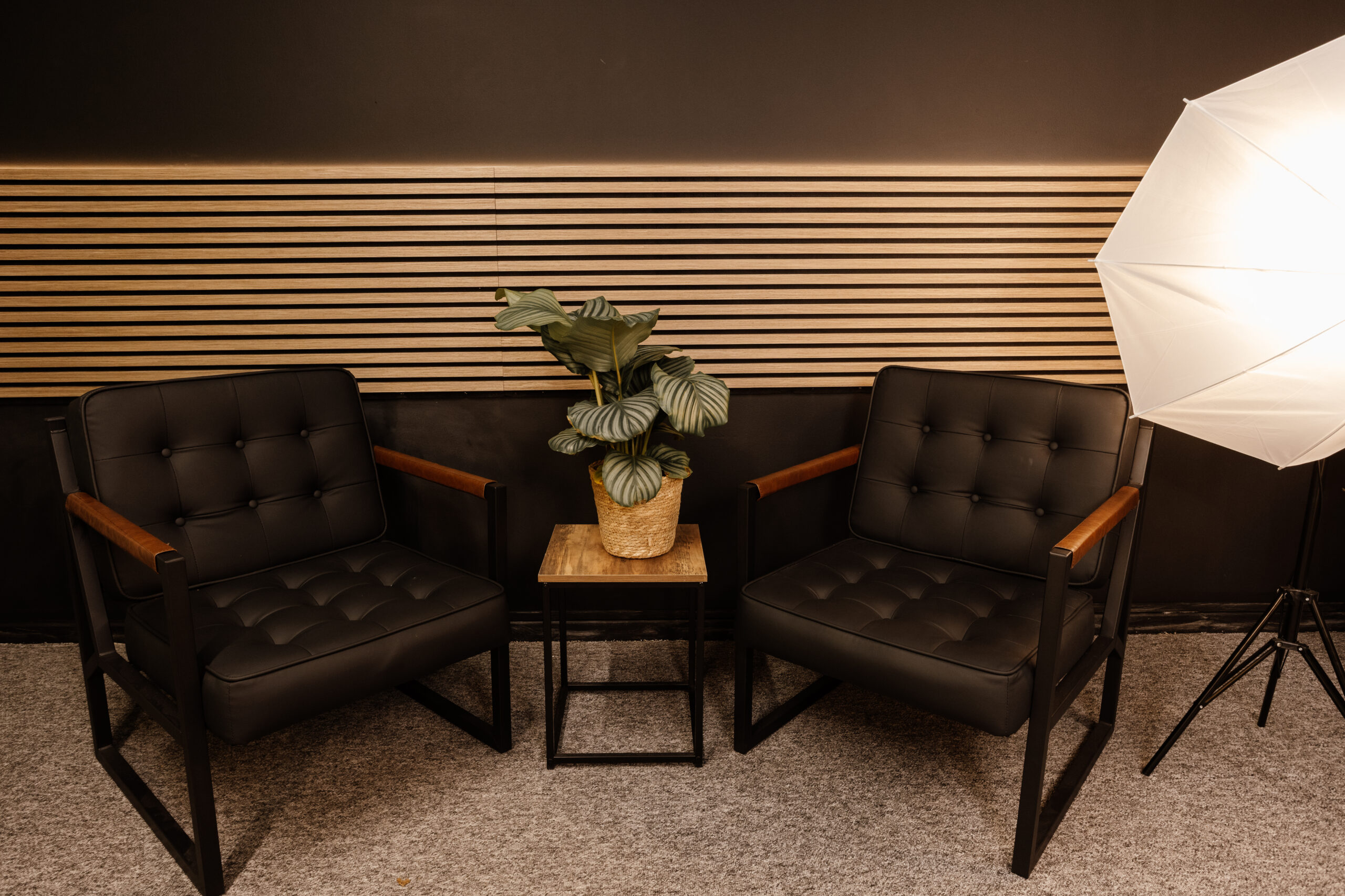 Podcast studio scene with seating arrangement and professional audio setup